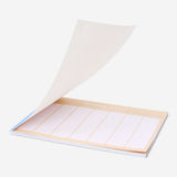 Blue A4 weekly planner from Flying Tiger Copenhagen with pages for organizing weekly schedules in an office setting.