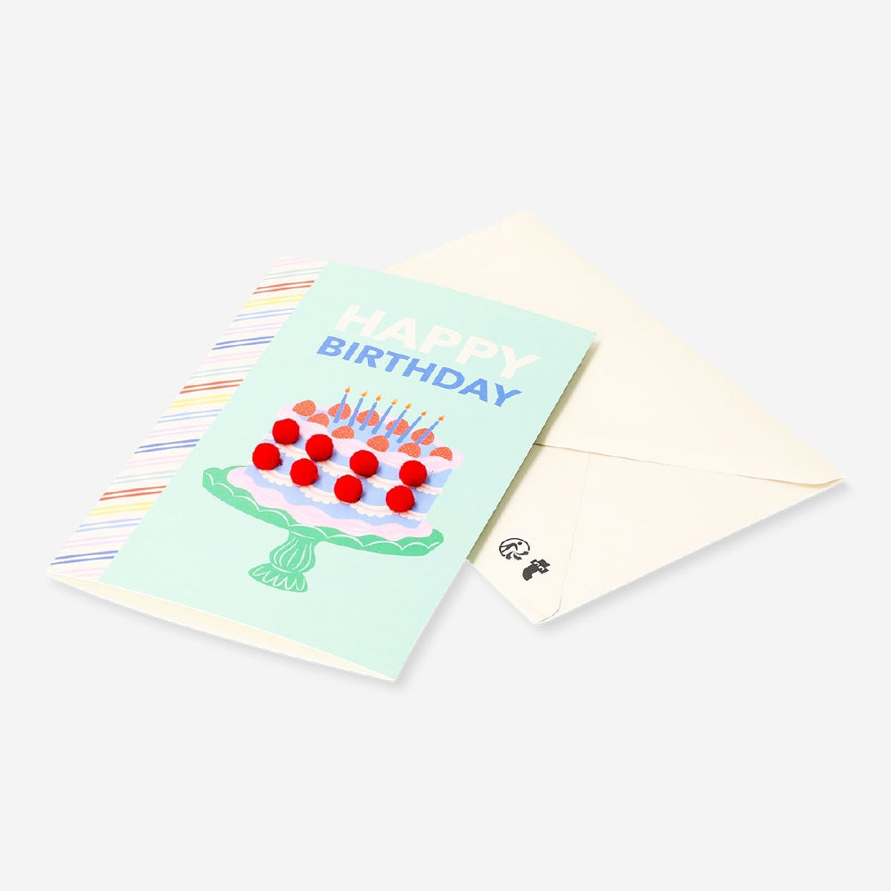 Office birthday card featuring a cake design with colorful pom poms, from Flying Tiger Copenhagen.