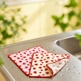 Two microfiber strawberry kitchen cloths by Flying Tiger Copenhagen, colorful and soft for cleaning and drying in the kitchen.