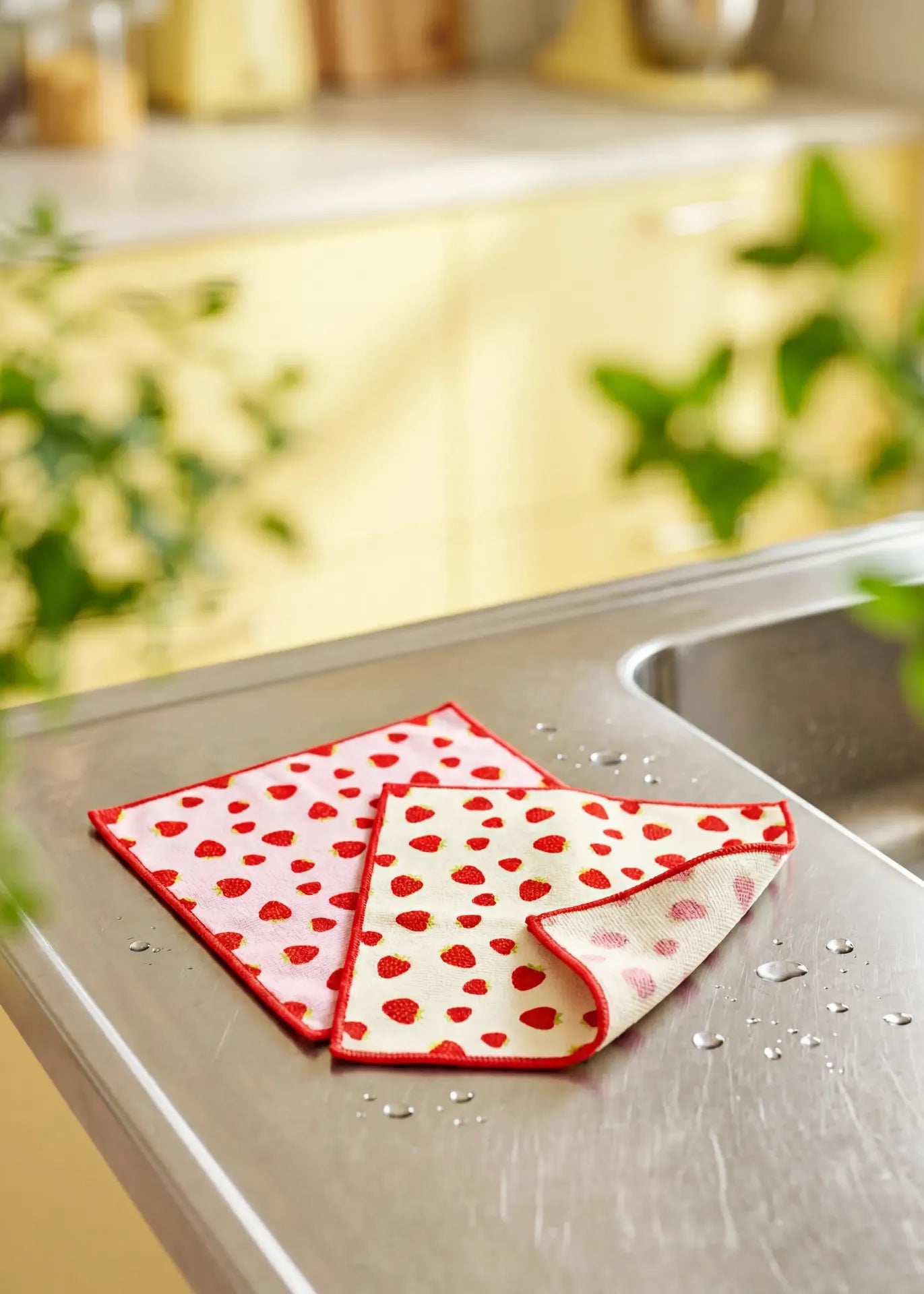 Two microfiber strawberry kitchen cloths by Flying Tiger Copenhagen, colorful and soft for cleaning and drying in the kitchen.