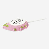 Marshmallow on a stick with dragon fruit flavor from Flying Tiger Copenhagen, pink and white marshmallow on a wooden stick.