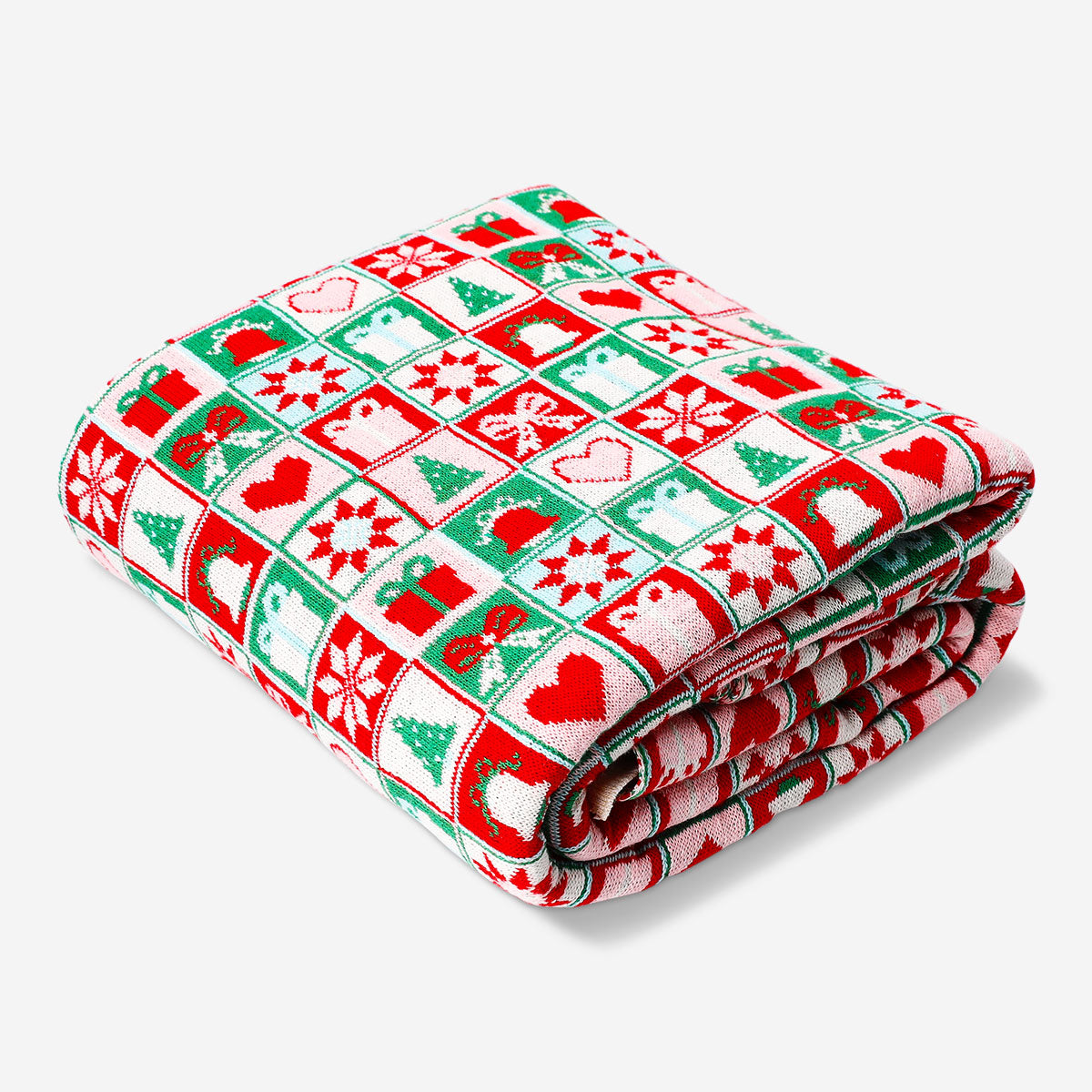 Knitted Christmas throw blanket from Flying Tiger Copenhagen, 120x150 cm, featuring festive red and white patterns for holiday cozy decor.