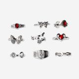 Set of nine adjustable gothic textile rings with romantic design from Flying Tiger Copenhagen, displayed on a neutral background.