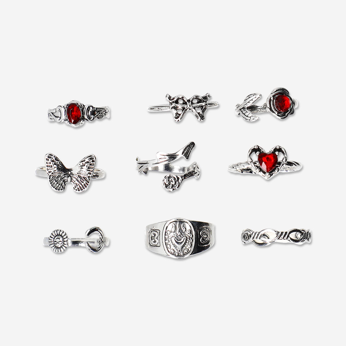 Set of nine adjustable gothic textile rings with romantic design from Flying Tiger Copenhagen, displayed on a neutral background.