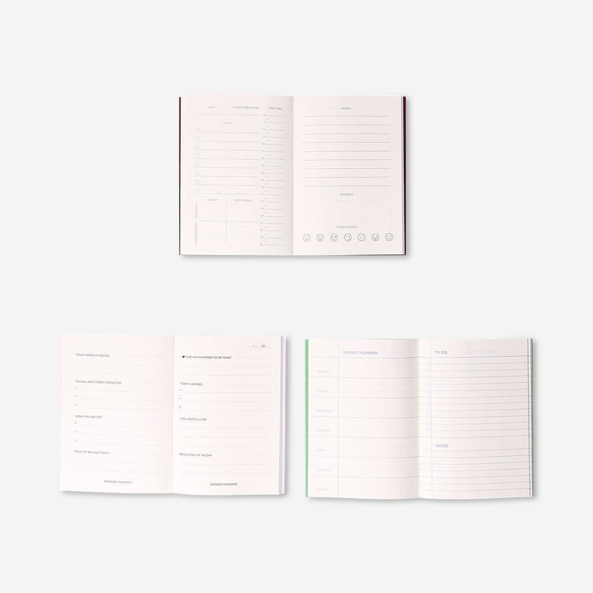 Set of three English A6 office planners by Flying Tiger Copenhagen with colorful covers and organized pages.