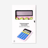 Pink solar-powered office calculator with digital display from Flying Tiger Copenhagen, featuring a compact design and solar panel.