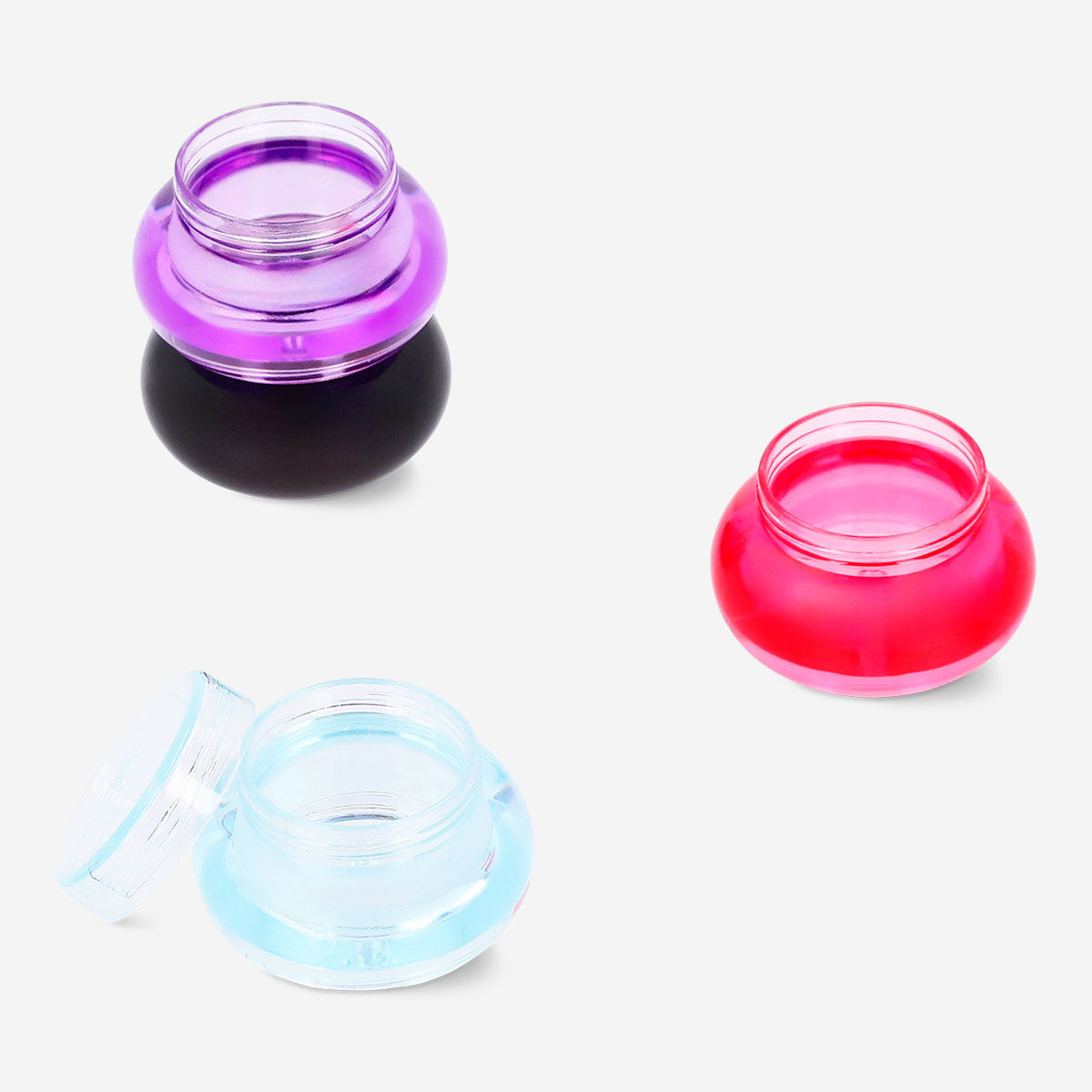 Four stackable travel jars in a leisure travel set by Flying Tiger Copenhagen, ideal for storing toiletries and small essentials.