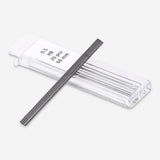 Flying Tiger Copenhagen propelling pencil refills for office use, showing a box of replacement leads on a desk.