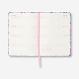 Flying Tiger Copenhagen B6 floral weekly diary 2027 in English, featuring a colorful floral cover and weekly planner pages.