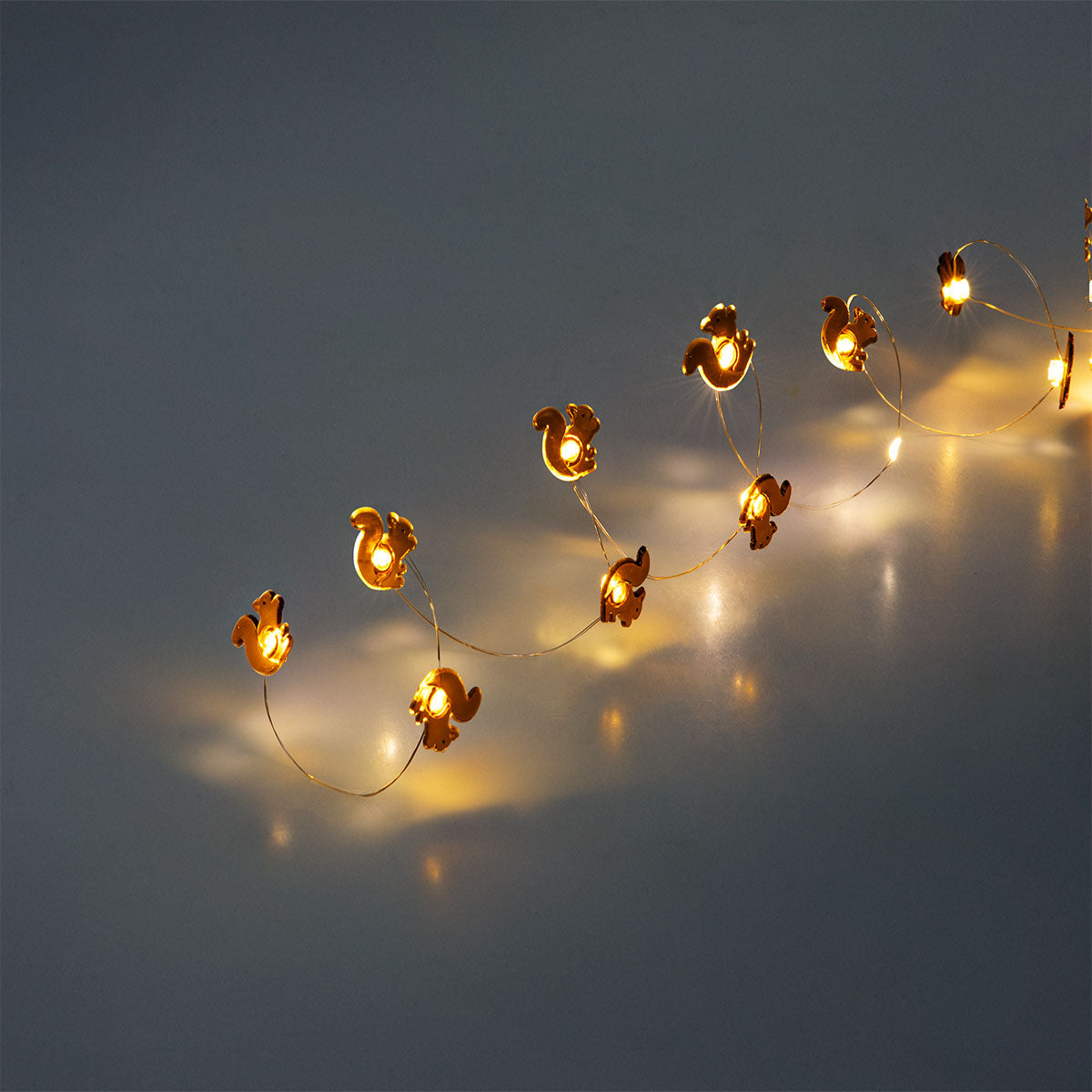 Brown squirrel string lights for home decor by Flying Tiger Copenhagen, featuring adorable squirrel-shaped bulbs on a warm light string.
