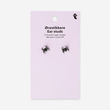 Silver spider stud earrings made of textile material, designed by Flying Tiger Copenhagen, featuring intricate spider-shaped details.