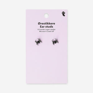 Silver spider stud earrings made of textile material, designed by Flying Tiger Copenhagen, featuring intricate spider-shaped details.