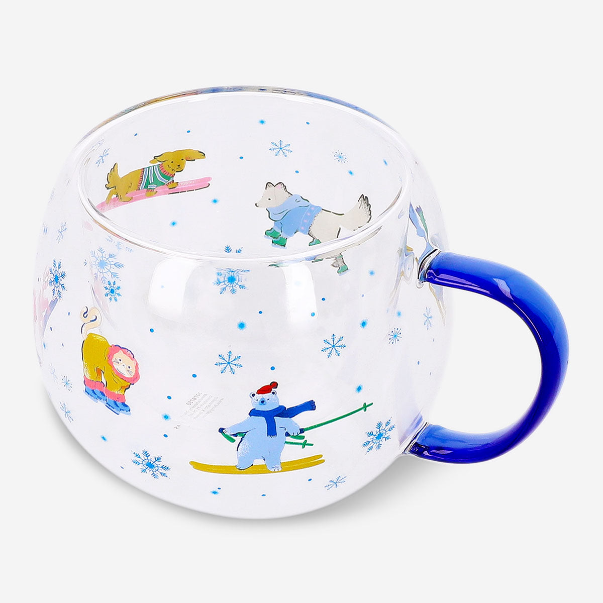 Flying Tiger Copenhagen Ski Village glass mug, 250 ml, kitchenware with a festive ski scene design, clear glass with handle.