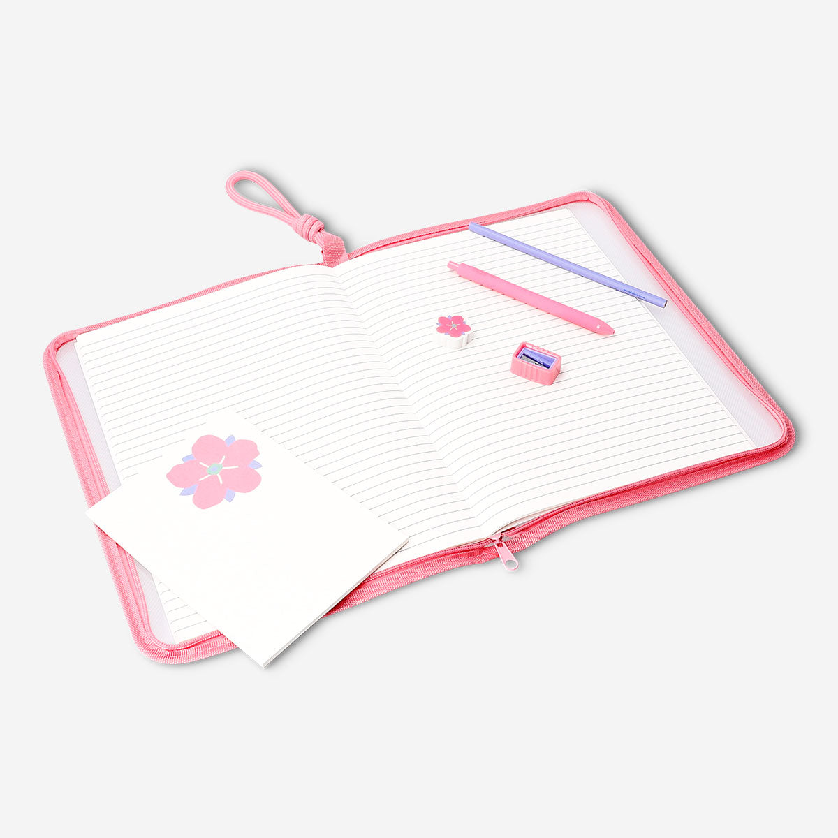 Assorted floral stationery kit with notebooks, pens, and stickers from Flying Tiger Copenhagen for office or school use.