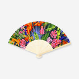 Foldable bamboo fan with tropical print textile by Flying Tiger Copenhagen, featuring a lightweight, eco-friendly design.