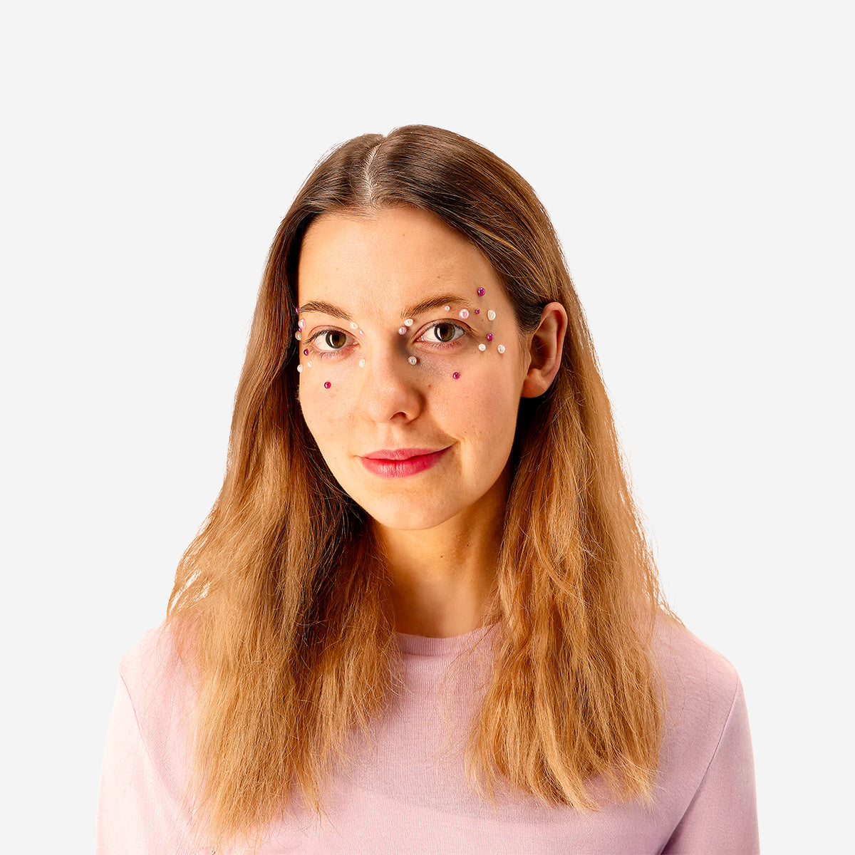 Adhesive pearls for face by Flying Tiger Copenhagen, small white pearl stickers for personal face decoration and skincare.