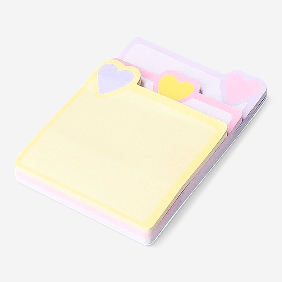 Pink heart-shaped sticky memos from Flying Tiger Copenhagen arranged on an office desk.
