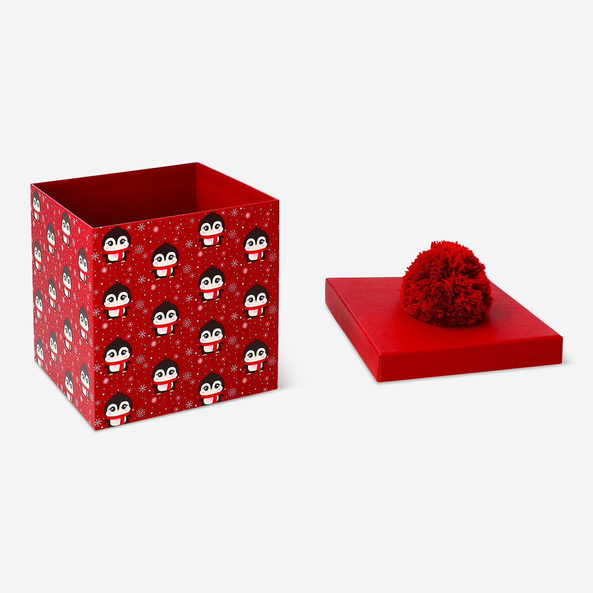 Office gift box featuring playful penguins and pom-pom decorations by Flying Tiger Copenhagen.
