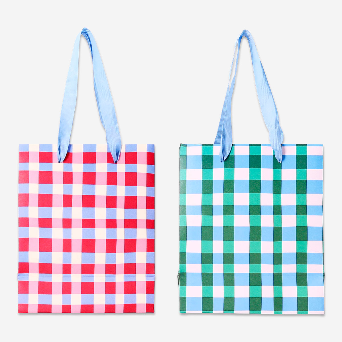 Four checkered gift bags from Flying Tiger Copenhagen, ideal for office gift wrapping, featuring a classic check pattern.