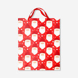 Office gift bag featuring Santa Claus design from Flying Tiger Copenhagen, ideal for holiday gift packaging.