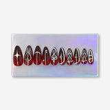 Red press-on nails with silver decorative design, from Flying Tiger Copenhagen, perfect for personal care and stylish nail accents.