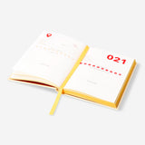 A6 travel journal by Flying Tiger Copenhagen featuring a compact office-style design with a textured cover and lined pages.