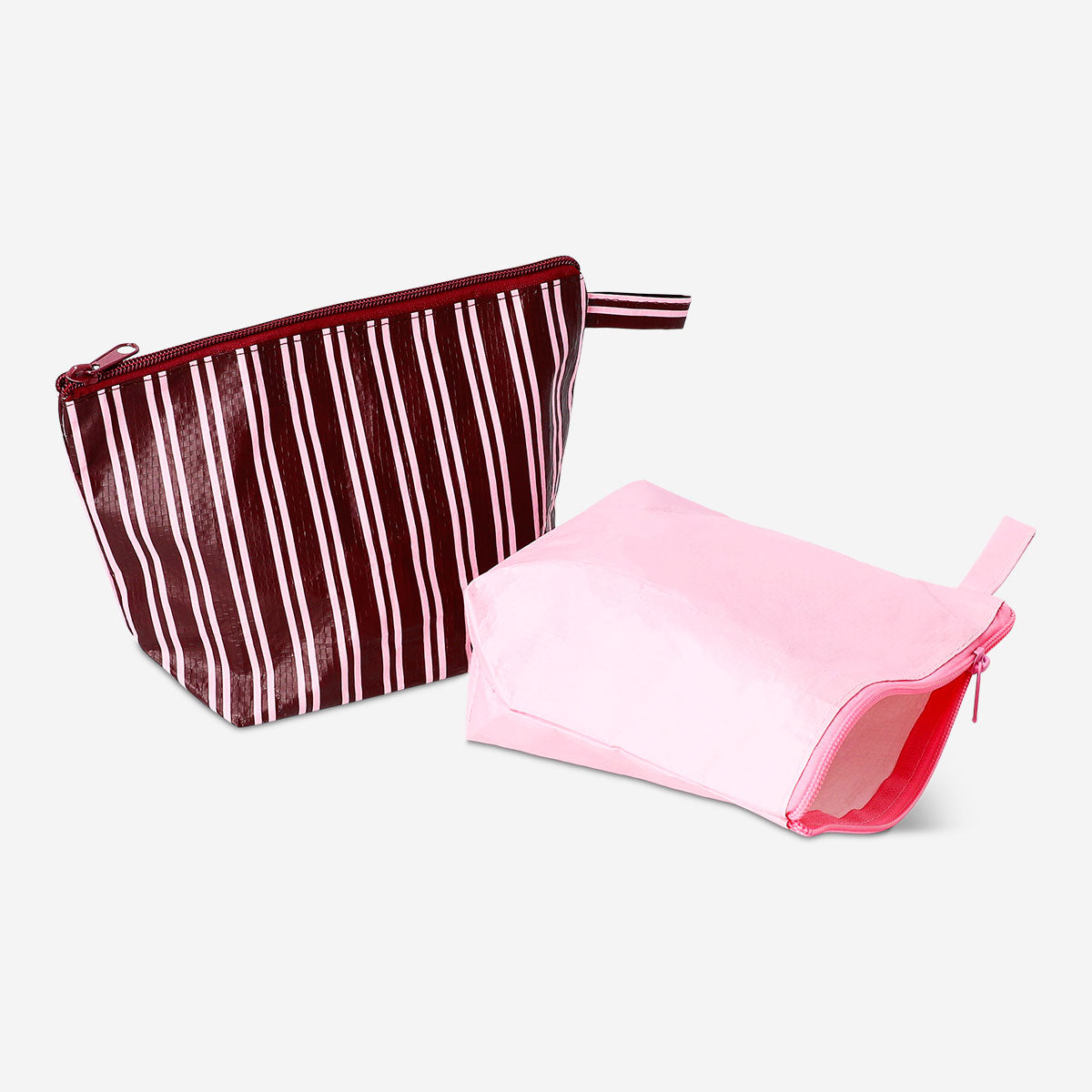 Pink and brown Flying Tiger Copenhagen leisure toiletry bags with zipper closures, featuring stylish, compact travel storage.