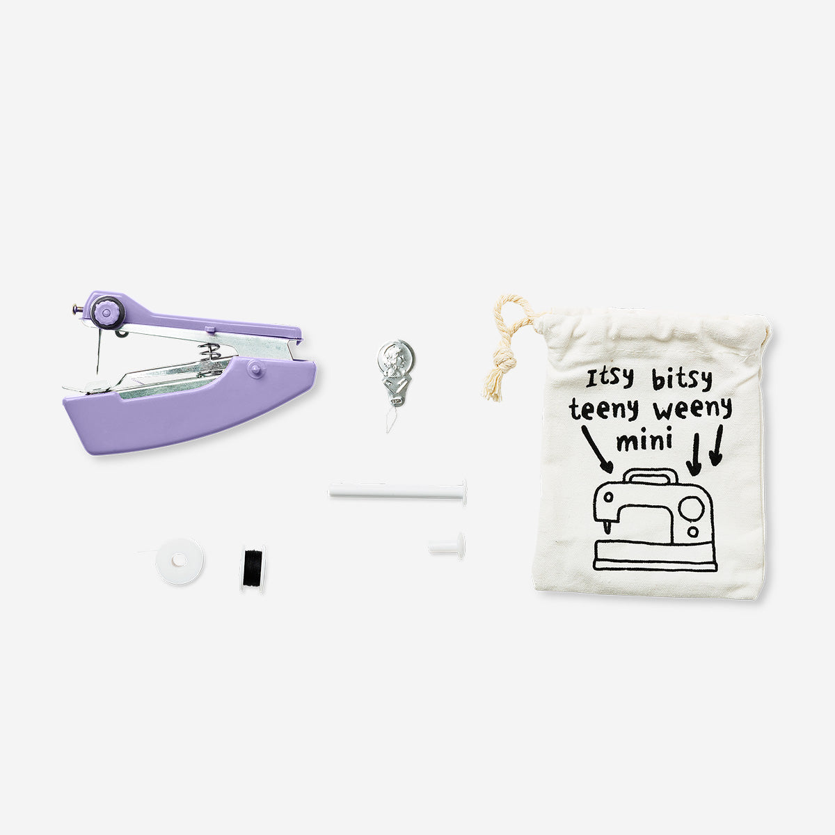 Purple handheld sewing machine by Flying Tiger Copenhagen, compact and suitable for hobby sewing projects.