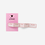 Pink greetings card with love vouchers