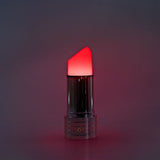Flying Tiger Copenhagen RuPaul's Drag Race lipstick-shaped cozy home lamp with vibrant pink color and soft lighting.
