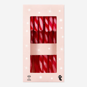 Eight strawberry-flavored candy canes from Flying Tiger Copenhagen, arranged in a clear view of the colorful striped treats.