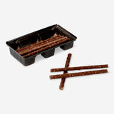 Chocolate sticks with popping candy from Flying Tiger Copenhagen, showing crispy chocolate treats with colorful popping candy pieces.