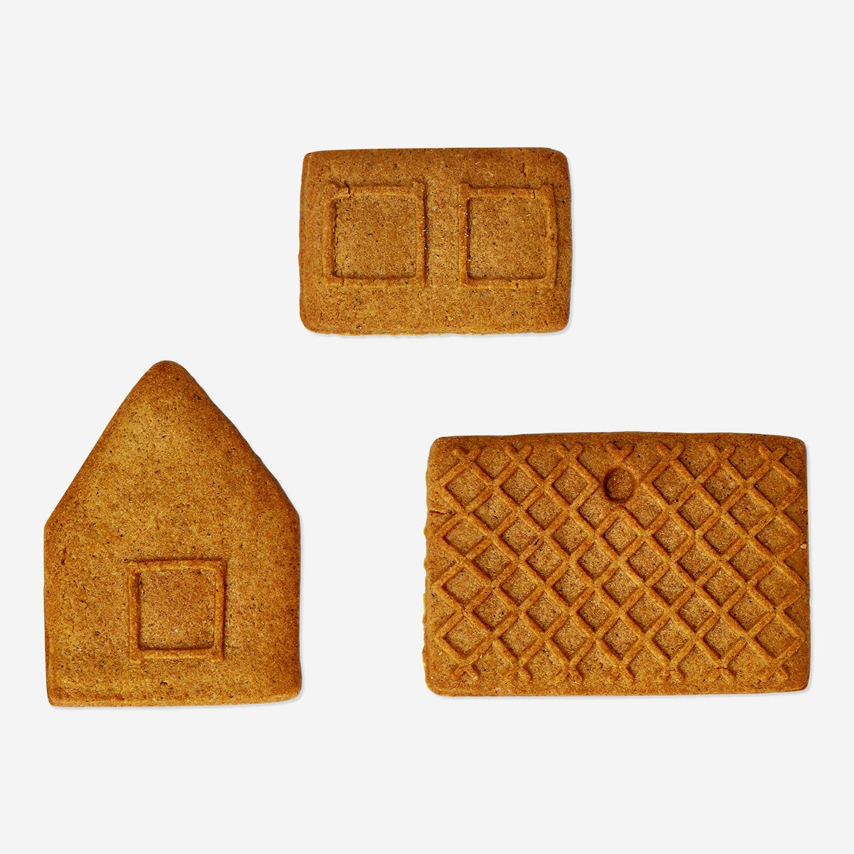 Set of three DIY mini gingerbread houses by Flying Tiger Copenhagen, perfect for holiday baking and festive decorations.
