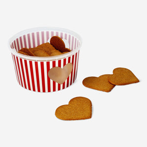 Flying Tiger Copenhagen gingerbread heart cookies, festive baked treats with detailed icing decoration on a plate.