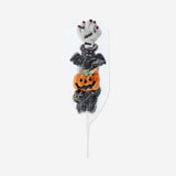 Vanilla-flavored Halloween marshmallow on a stick from Flying Tiger Copenhagen, featuring festive orange and black packaging.