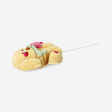 Vanilla-flavored marshmallow dog on a stick from Flying Tiger Copenhagen, showcasing a sweet, soft treat with colorful packaging.