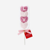 Strawberry-flavored marshmallow hearts on a stick from Flying Tiger Copenhagen, soft and sweet candy treat.