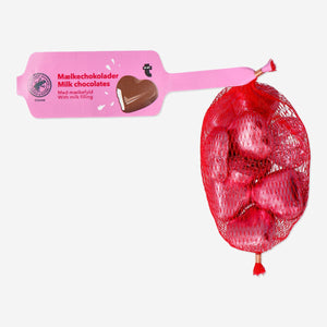 Milky cream-flavored chocolate hearts by Flying Tiger Copenhagen, shown in a net with creamy filling inside.