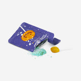 Popping pumpkin lollipop by Flying Tiger Copenhagen with sour raspberry flavor, showing a bright orange pumpkin-shaped candy.