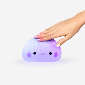 Color-changing dumpling gadget lamp by Flying Tiger Copenhagen, soft glow and playful design for cozy lighting.