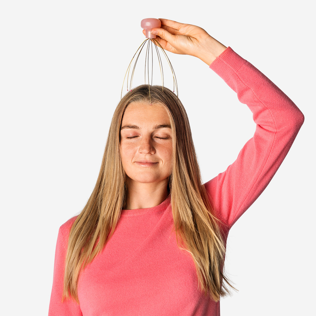 Gold head massager gadget from Flying Tiger Copenhagen with rounded metal tips for scalp relaxation and soothing massage.