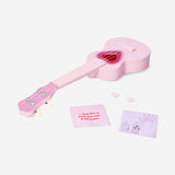 Pink ukulele with heart cut out
