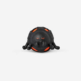 Black spider press me toy gadget from Flying Tiger Copenhagen, featuring a playful spider design with a soft, squeezable body.