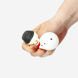 Flying Tiger Copenhagen press me snowman gadget with a cheerful snowman figure and interactive design for fun toy interaction.