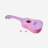 Flying Tiger Copenhagen ukulele gadget with colorful doughnut print, showcasing a fun, compact musical instrument design.