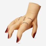 Flying Tiger Copenhagen walking hand gadget with sound, a playful plastic hand that moves and makes noise when activated.