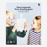 Nose-drawing game for four players by Flying Tiger Copenhagen, featuring game pieces and a colorful playing surface.