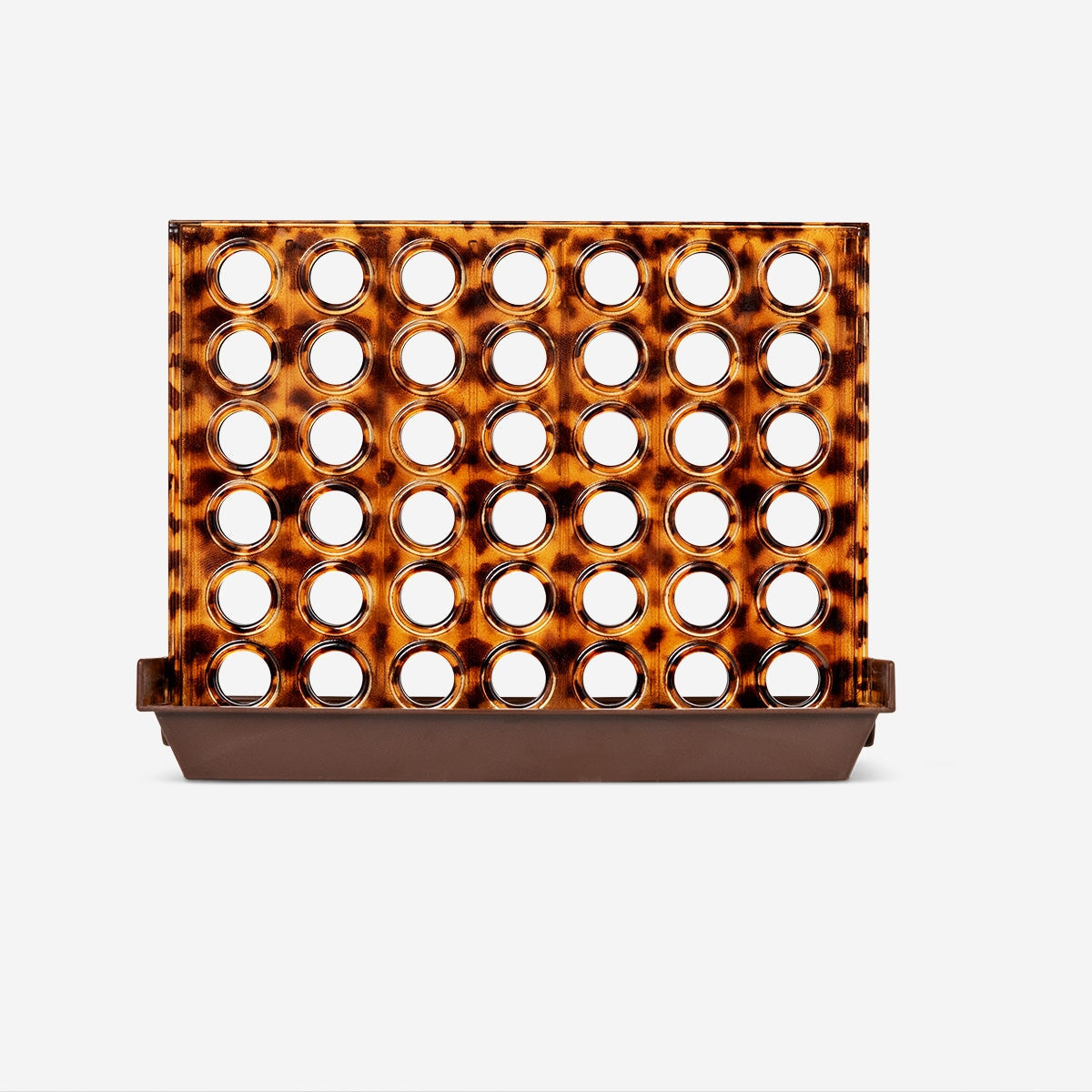 Tortoiseshell Four In A Row game by Flying Tiger Copenhagen, featuring a compact wooden game with colorful pieces and a grid layout.