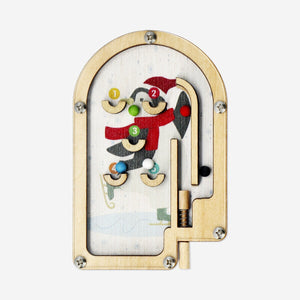 Wooden pinball game by Flying Tiger Copenhagen featuring colorful metal balls and wooden ramps on a flat surface.