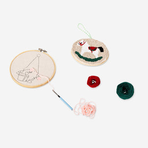 Flying Tiger Copenhagen Christmas punch needle set with two hobby craft tools, featuring festive designs and colorful embroidery threads.